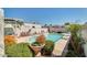 Community pool area with colorful chairs and a shaded seating area at 8014 E Oak St, Scottsdale, AZ 85257