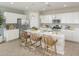 Modern kitchen with white cabinets and a large island at 8235 E Petunia Ave, Mesa, AZ 85212