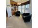 Cozy sitting area with two black leather chairs and a built-in hutch at 8700 E University Dr # 633, Mesa, AZ 85207