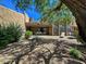 Spacious backyard with patio, lounge chairs, and desert landscaping at 9223 E Whitethorn Cir # 667, Scottsdale, AZ 85266