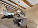 Elegant dining room features a large table, wood beams, and access to the living room at 9223 E Whitethorn Cir # 667, Scottsdale, AZ 85266