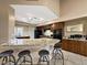 Spacious kitchen with granite countertops and dark wood cabinets at 9223 E Whitethorn Cir # 667, Scottsdale, AZ 85266