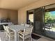 Covered patio with a dining table, chairs, and a built-in grill at 9223 E Whitethorn Cir # 667, Scottsdale, AZ 85266