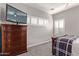 Well-lit bedroom with dresser and window shutters at 943 E Kortsen Rd # 10, Casa Grande, AZ 85122