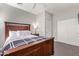 Cozy bedroom with wood bed frame and window shutters at 943 E Kortsen Rd # 10, Casa Grande, AZ 85122