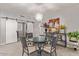 Bright dining area with glass-top table, chandelier, and comfortable seating at 943 E Kortsen Rd # 10, Casa Grande, AZ 85122