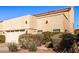 Front view of two-story home with attached garage and landscaping at 943 E Kortsen Rd # 10, Casa Grande, AZ 85122