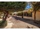 Side yard view with gravel landscaping and a stucco building at 943 E Kortsen Rd # 10, Casa Grande, AZ 85122