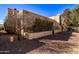 Back exterior view showing a stucco building with a desert landscape at 943 E Kortsen Rd # 10, Casa Grande, AZ 85122