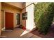 Inviting front door entrance with a terracotta door and landscaping at 943 E Kortsen Rd # 10, Casa Grande, AZ 85122