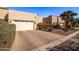 Attached garage with double doors and landscaping at 943 E Kortsen Rd # 10, Casa Grande, AZ 85122