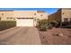 Attached garage with double doors and landscaping at 943 E Kortsen Rd # 10, Casa Grande, AZ 85122