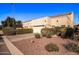 Attached garage with double doors and landscaping at 943 E Kortsen Rd # 10, Casa Grande, AZ 85122