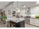 Modern kitchen with marble island, stainless steel appliances, and white cabinetry at 943 E Kortsen Rd # 10, Casa Grande, AZ 85122