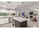 Modern kitchen with marble island, stainless steel appliances, and white cabinets at 943 E Kortsen Rd # 10, Casa Grande, AZ 85122