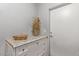 Laundry room with white cabinets, granite countertop, and storage at 943 E Kortsen Rd # 10, Casa Grande, AZ 85122