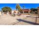 Community pool area with seating and a stone patio at 943 E Kortsen Rd # 10, Casa Grande, AZ 85122