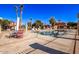 Community pool with surrounding patio furniture at 943 E Kortsen Rd # 10, Casa Grande, AZ 85122