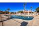 Inviting community pool with lounge chairs and patio area at 943 E Kortsen Rd # 10, Casa Grande, AZ 85122