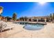 Relaxing kidney-shaped pool with surrounding patio at 943 E Kortsen Rd # 10, Casa Grande, AZ 85122