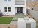 Modern backyard with patio, artificial grass, and grill at 9831 S 11Th St, Phoenix, AZ 85042