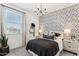 Bedroom with patterned wallpaper and modern furniture at 9831 S 11Th St, Phoenix, AZ 85042