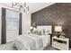 Bedroom with dark-colored accent wall and modern decor at 9831 S 11Th St, Phoenix, AZ 85042