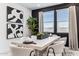 Bright dining room with a large table and modern art at 9831 S 11Th St, Phoenix, AZ 85042