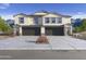 Two-story home with attached garage and desert landscaping at 9831 S 11Th St, Phoenix, AZ 85042