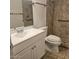 Bathroom with single vanity, toilet, and walk-in shower at 10216 W Ironwood Dr, Sun City, AZ 85351