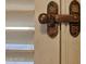 Close-up view of an ornate door latch at 10216 W Ironwood Dr, Sun City, AZ 85351