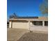 House exterior with a solar panel system and attached garage at 10216 W Ironwood Dr, Sun City, AZ 85351