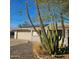 House exterior showcasing a garage and cacti garden at 10216 W Ironwood Dr, Sun City, AZ 85351