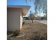 Side yard view, showing gravel landscaping and a tree at 10216 W Ironwood Dr, Sun City, AZ 85351