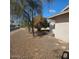 Landscaped front yard with gravel and mature trees at 10216 W Ironwood Dr, Sun City, AZ 85351