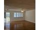 Spacious living room with wood flooring and ceiling fan at 10216 W Ironwood Dr, Sun City, AZ 85351