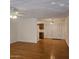 Bright and spacious living room with wood flooring and ceiling fan at 10216 W Ironwood Dr, Sun City, AZ 85351