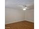 Bright living room with hardwood floors and ceiling fan at 10216 W Ironwood Dr, Sun City, AZ 85351