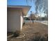 Side yard with gravel landscaping and a tree at 10216 W Ironwood Dr, Sun City, AZ 85351