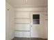 Storage room with shelving and exterior access at 10216 W Ironwood Dr, Sun City, AZ 85351