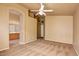 Carpeted main bedroom featuring archway leading to the ensuite bathroom and walk-in closet at 10238 E Blanche Dr, Scottsdale, AZ 85255