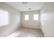 Bright bedroom with carpeted floors and large windows at 10332 W Devonshire Ave, Phoenix, AZ 85037