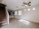 Spacious living room with tile floors and a view of the kitchen at 10332 W Devonshire Ave, Phoenix, AZ 85037