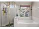 Bathroom with shower and bathtub at 10339 N 58Th Ln, Glendale, AZ 85302