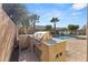 Outdoor kitchen and pool with artificial turf at 10457 E Pivitol Ave, Mesa, AZ 85212