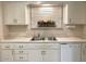 Kitchen sink and dishwasher in white cabinets at 10526 W Crosby Dr, Sun City, AZ 85351