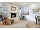 Living room with a fireplace and plenty of natural light at 10555 E Bella Vista Dr, Scottsdale, AZ 85258