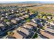 Aerial view of a residential neighborhood with a focus on one house at 10808 W Cottontail Ln, Peoria, AZ 85383