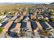 Aerial view of a house and neighborhood with mountain views at 10808 W Cottontail Ln, Peoria, AZ 85383