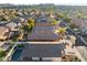 Aerial view of house with pool and a neighborhood in the background at 10808 W Cottontail Ln, Peoria, AZ 85383